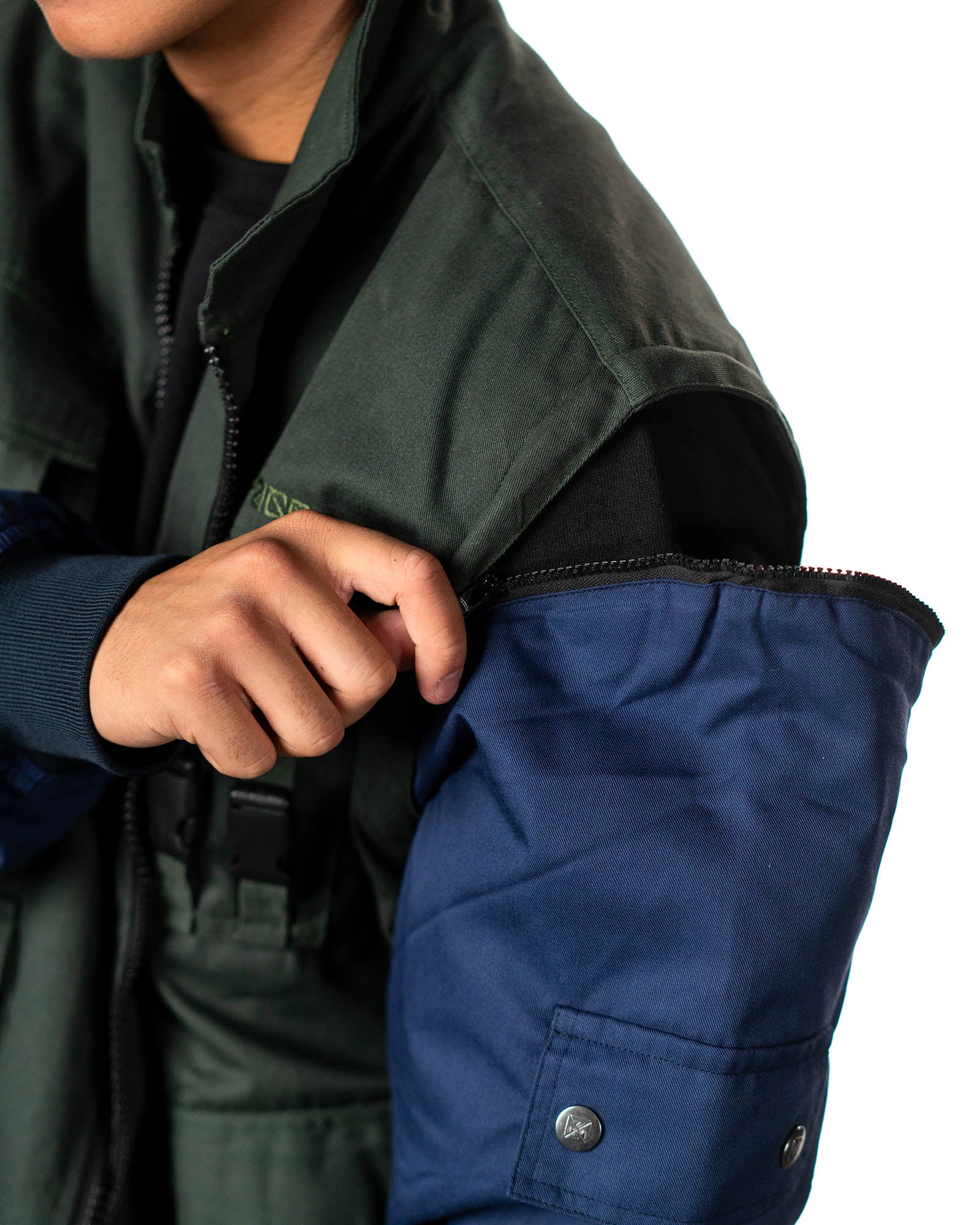 Naruto Shippuden Jonin Jacket removable sleeve detail showing the zipper connection between the green vest and navy sleeve