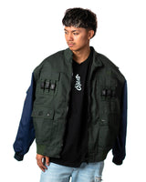 Official Naruto Shippuden Jonin Jacket open front view with green vest shell, navy sleeves, black zipper and tactical buckle accents