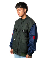 Naruto Shippuden Jonin Jacket side view showing green vest body, navy sleeve and red Uzumaki spiral sleeve patch