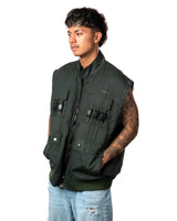 Official Naruto Shippuden Jonin Jacket shown as a sleeveless green vest with front zipper, tactical buckle details and pockets