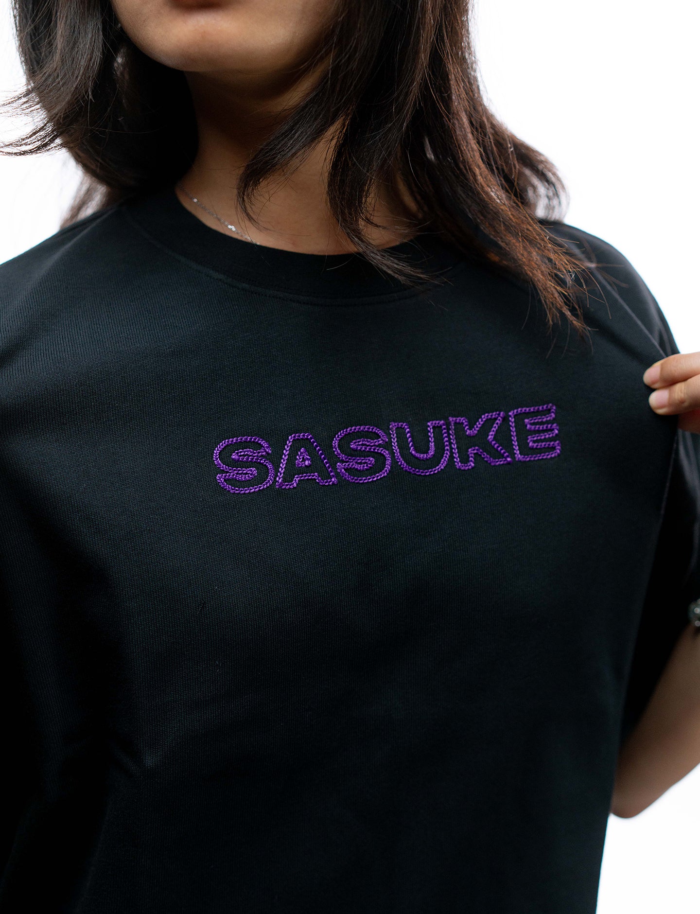 Naruto Shippuden Sasuke Uchiha purple line art oversized shirt front logo closeup