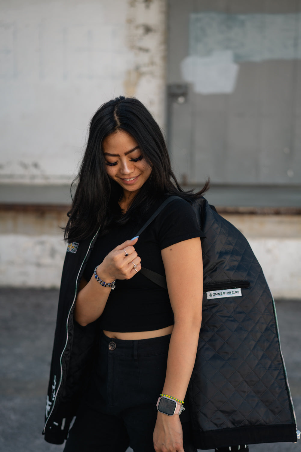Side profile of the black denim Soul Eater jacket featuring shoulder straps