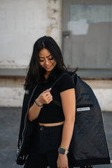 Side profile of the black denim Soul Eater jacket featuring shoulder straps