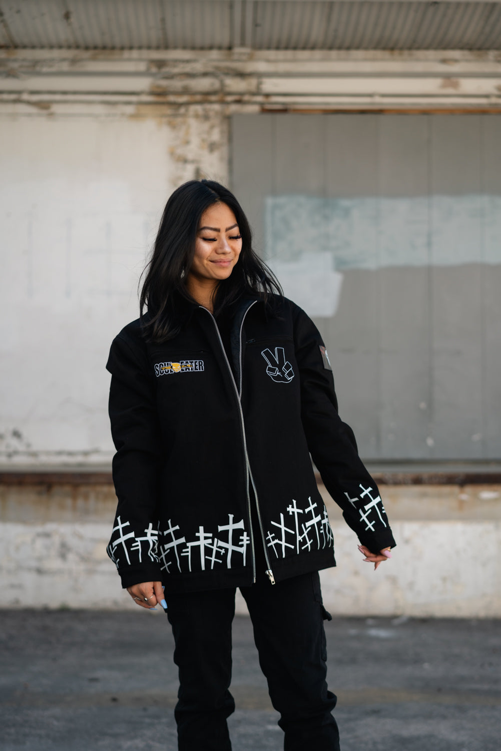 Full-length shot of the oversized Soul Eater jacket styled with black cargo pants