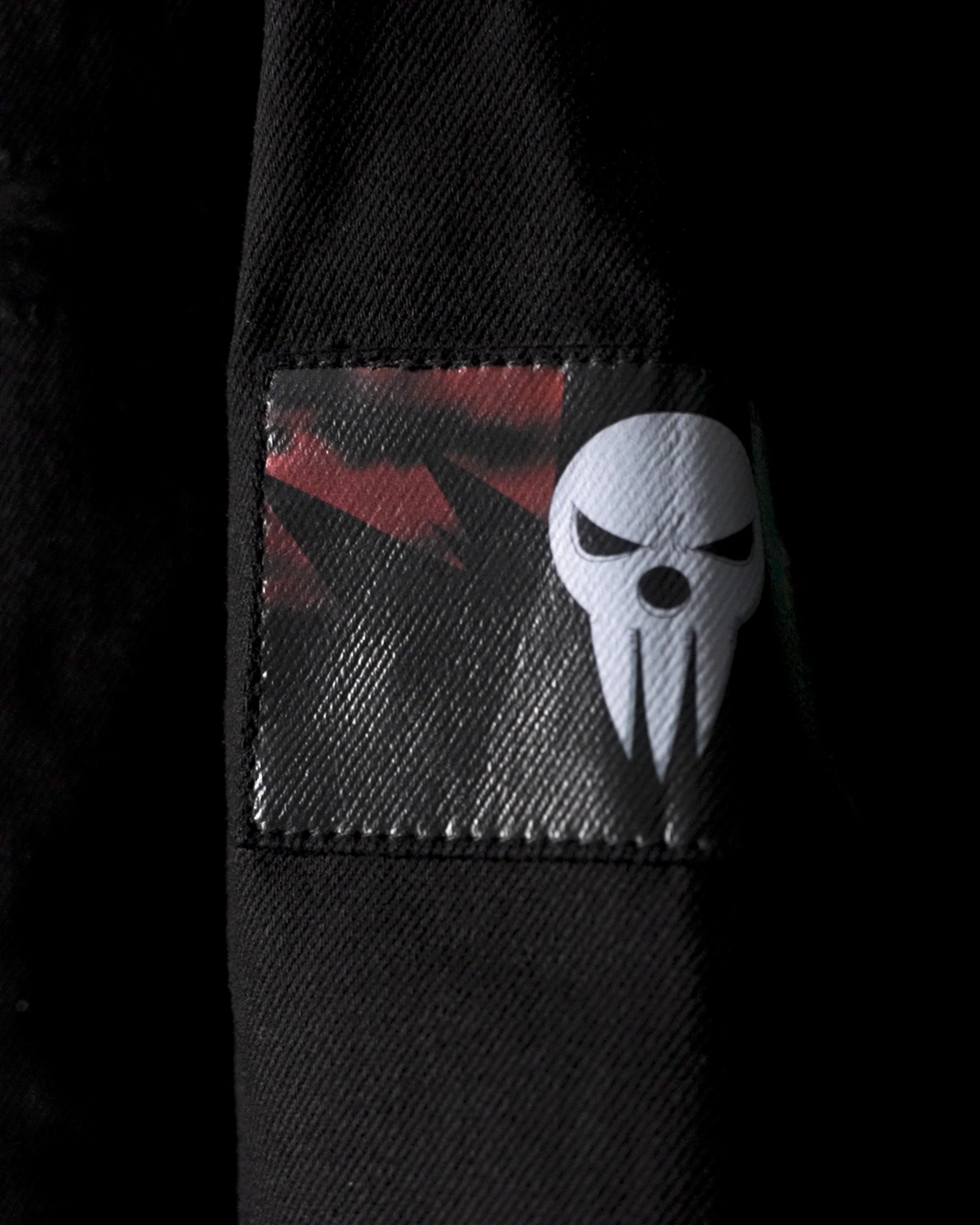 Close-up of the Lord Death mask graphic on a textured sleeve patch.