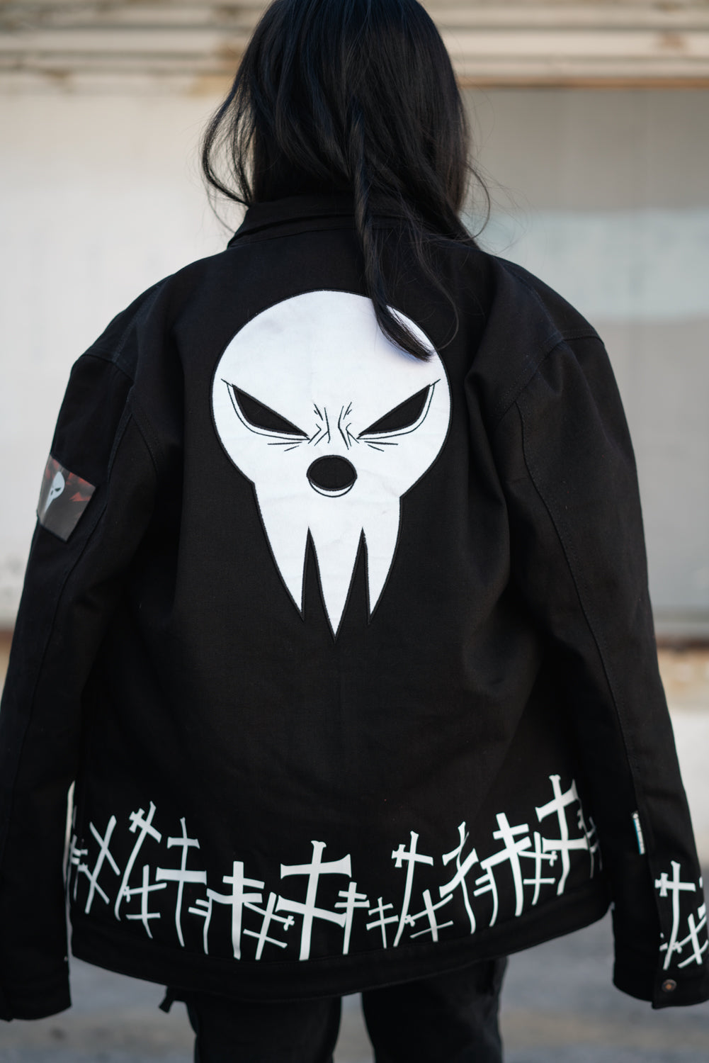 Back view showing the large Lord Death mask embroidery and cross pattern
