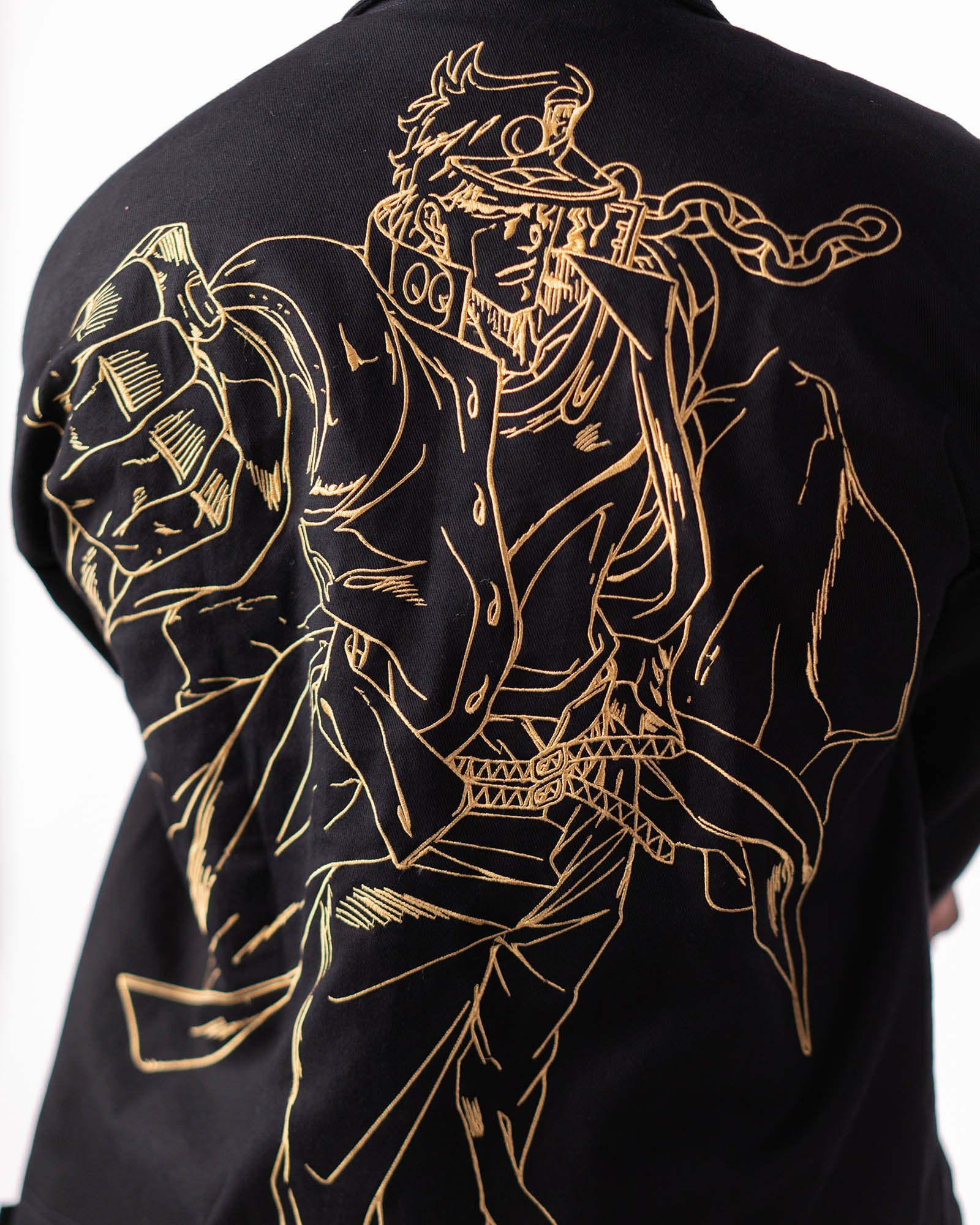 Detailed close-up of the gold Jotaro embroidery.