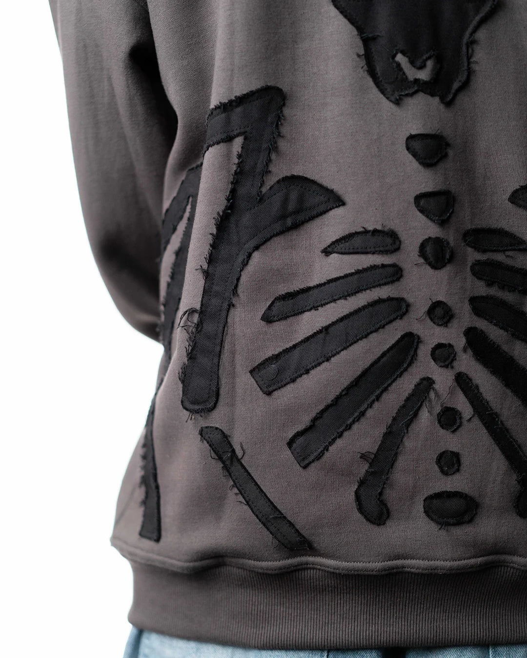 Wind Breaker keel gray skeleton hoodie lower back rib applique left angle