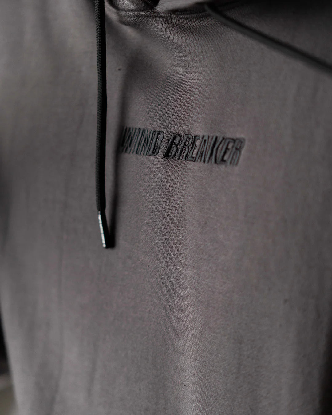 Wind Breaker keel gray skeleton hoodie tonal front logo close up