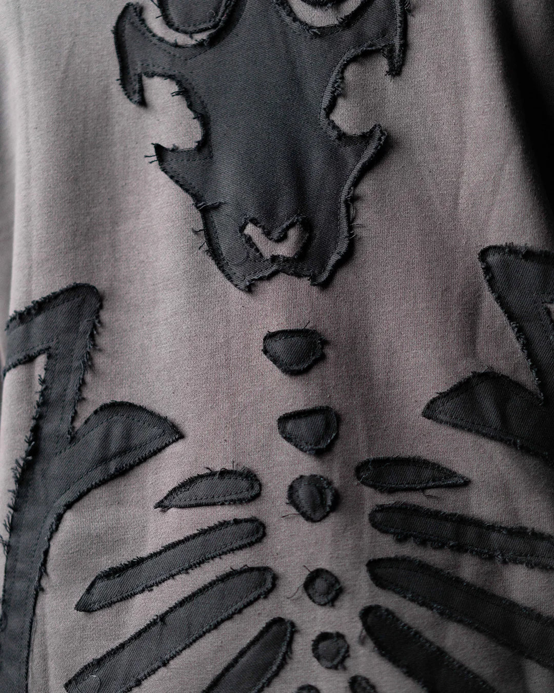 Wind Breaker keel gray skeleton hoodie upper back skull applique detail